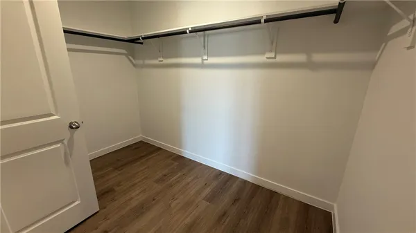 a view of an empty walk in closet