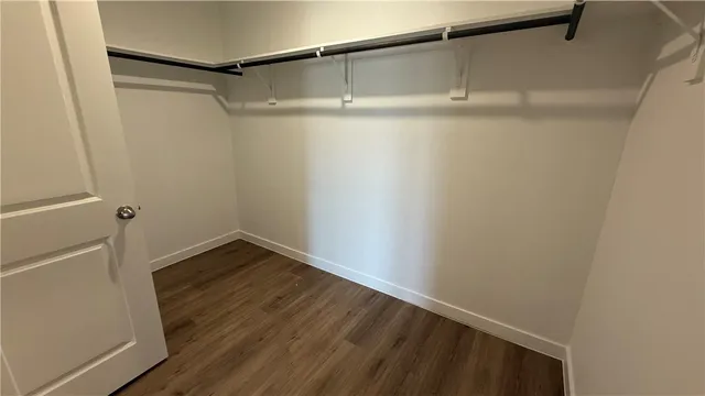 a view of an empty walk in closet
