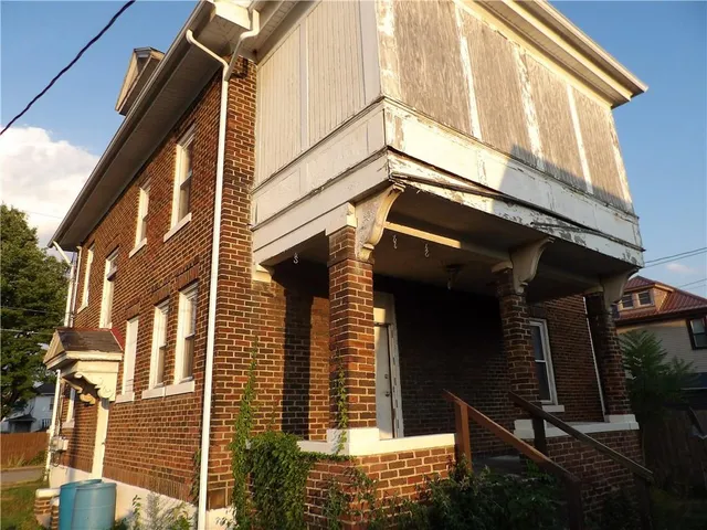 a front view of a house with a garage