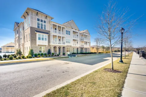 a view of a street with a building in the background