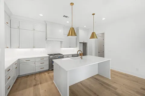 a bathroom with a double vanity sink and mirror