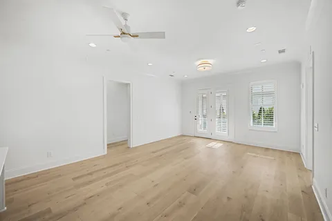 a bathroom with 2 sink mirror and a toilet