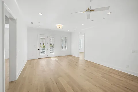 a spacious bathroom with a mirror a sink and a shower