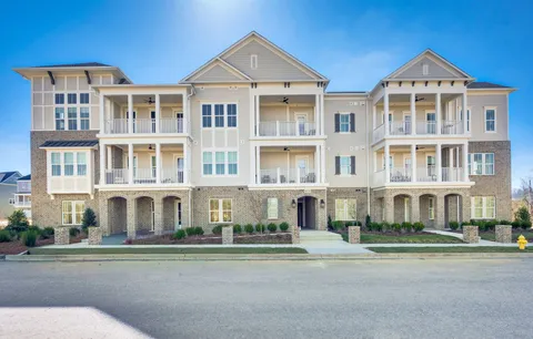 a front view of a building with lot of windows