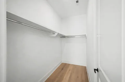 a view of a balcony and floor to ceiling windows