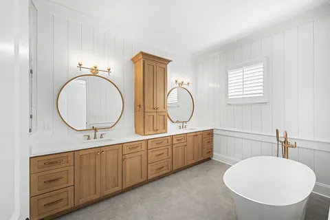 a view of a lake with a table and chairs