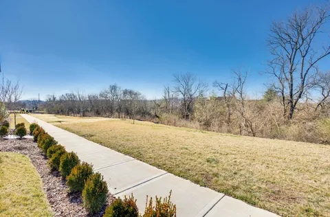 front view of a house with a small yard