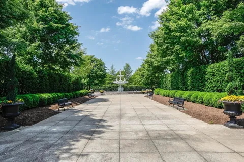 a view of a lake with houses in the back