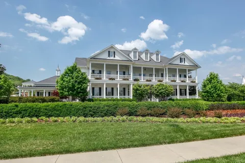a view of a park with large trees