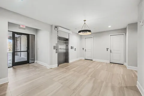 a kitchen with kitchen island a sink appliances and a counter top space
