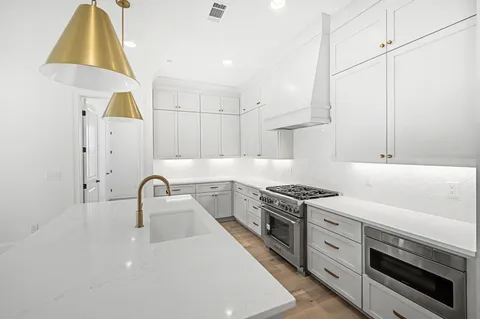 an empty room with a window and ceiling fan