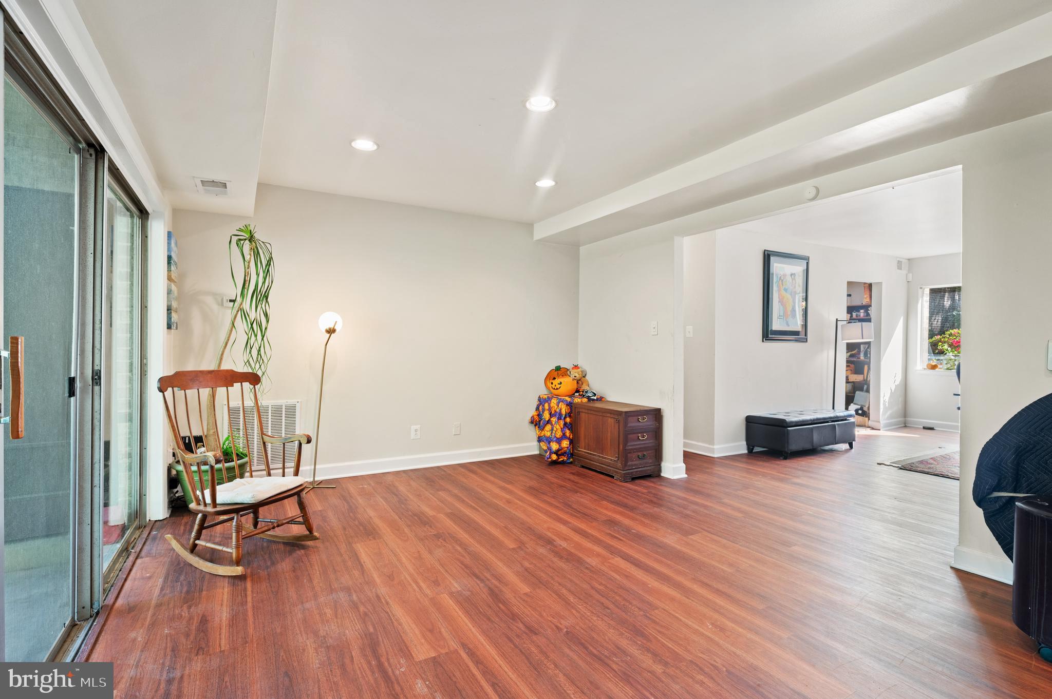 11616 Vantage Hill Road, Unit 2C Reston, VA 20190 - Photo 2 of 23 Living room flows into the dining and hall