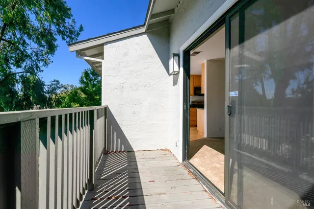 a balcony view with a glass door
