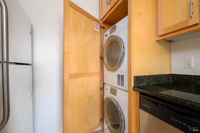 a close view of a utility room with dryer and washer