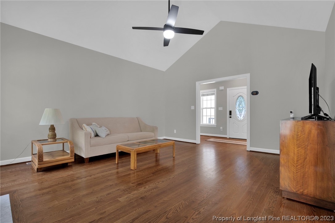 369 Grand Stand Lane Angier, NC 27501 - Photo 11 of 33 a living room with furniture and a flat screen tv