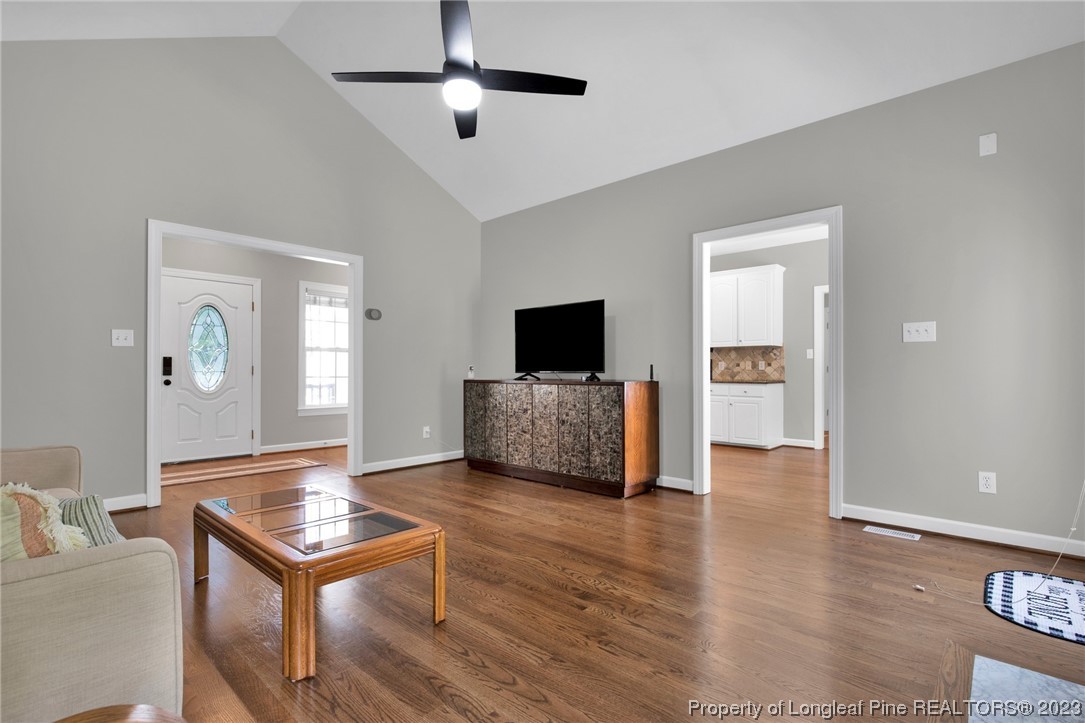 369 Grand Stand Lane Angier, NC 27501 - Photo 12 of 33 a living room with furniture and a flat screen tv