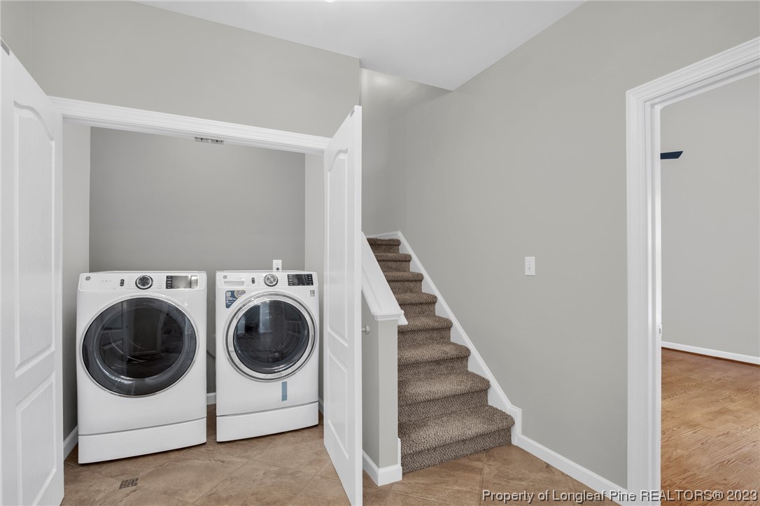 369 Grand Stand Lane Angier, NC 27501 - Photo 18 of 33 a utility room with dryer and washer