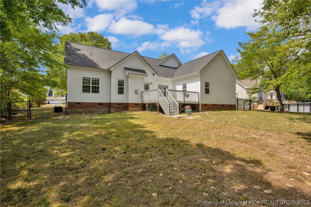 369 Grand Stand Lane Angier, NC 27501 - Photo 2 of 33 a front view of house with yard and trees