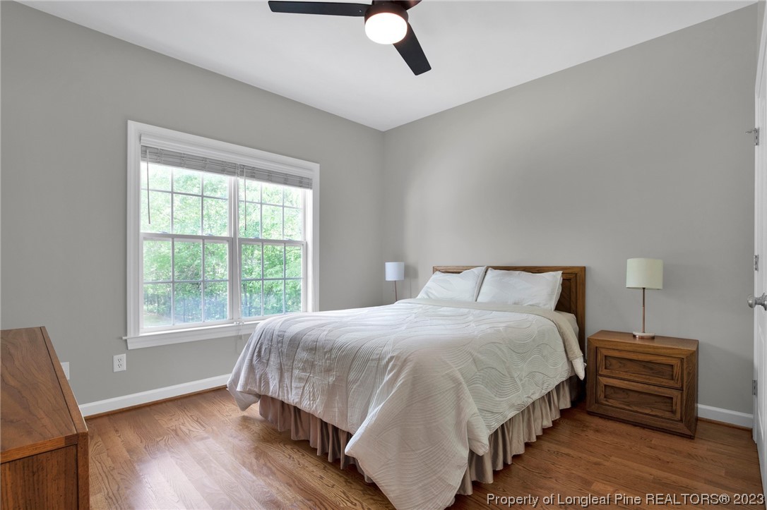 369 Grand Stand Lane Angier, NC 27501 - Photo 27 of 33 a bedroom with a bed and wooden floor