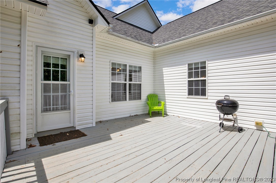 369 Grand Stand Lane Angier, NC 27501 - Photo 28 of 33 a backyard of a house with seating space