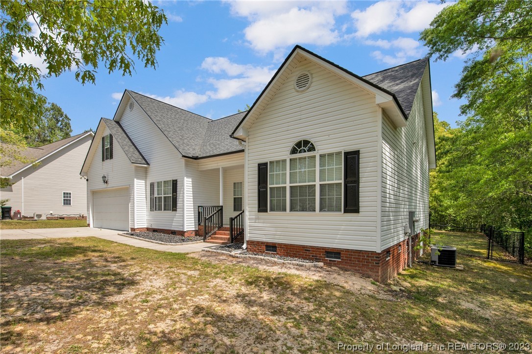 369 Grand Stand Lane Angier, NC 27501 - Photo 6 of 33 a view of a house with a yard