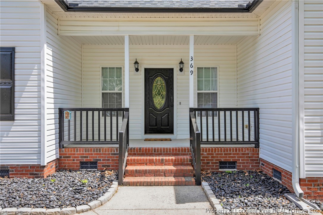 369 Grand Stand Lane Angier, NC 27501 - Photo 8 of 33 a front view of a house with entryway