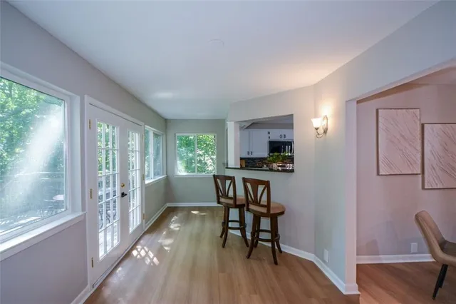 a view of a livingroom with furniture and a window