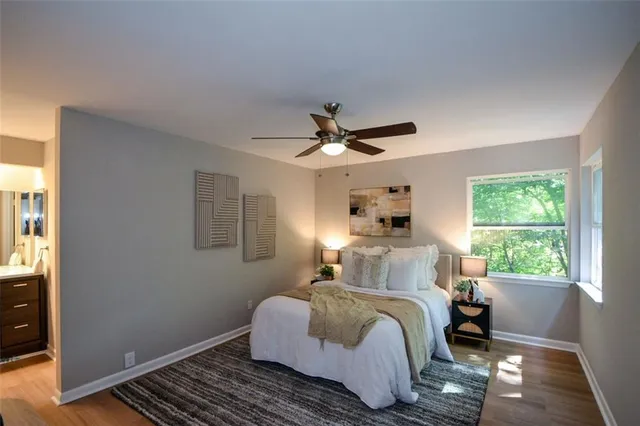 a bedroom with a bed and a window