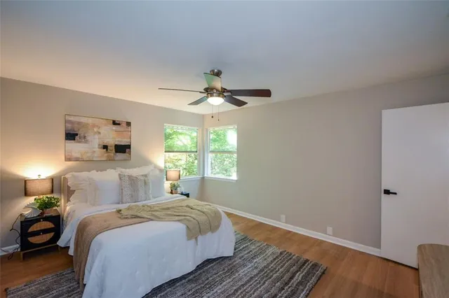 a bedroom with a bed and window