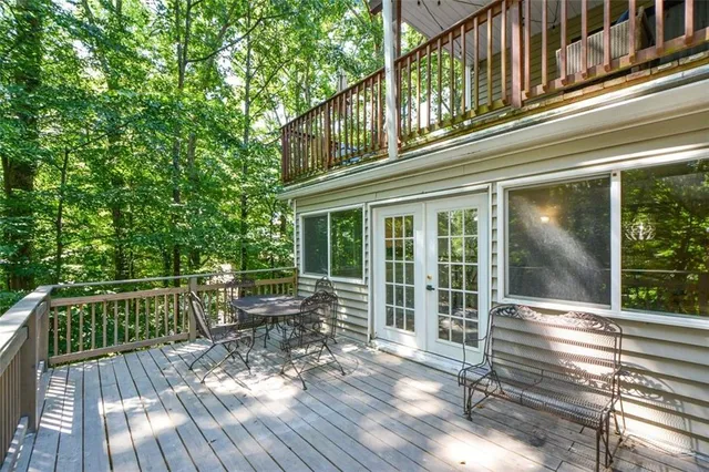 a view of a two chair and tables in the balcony