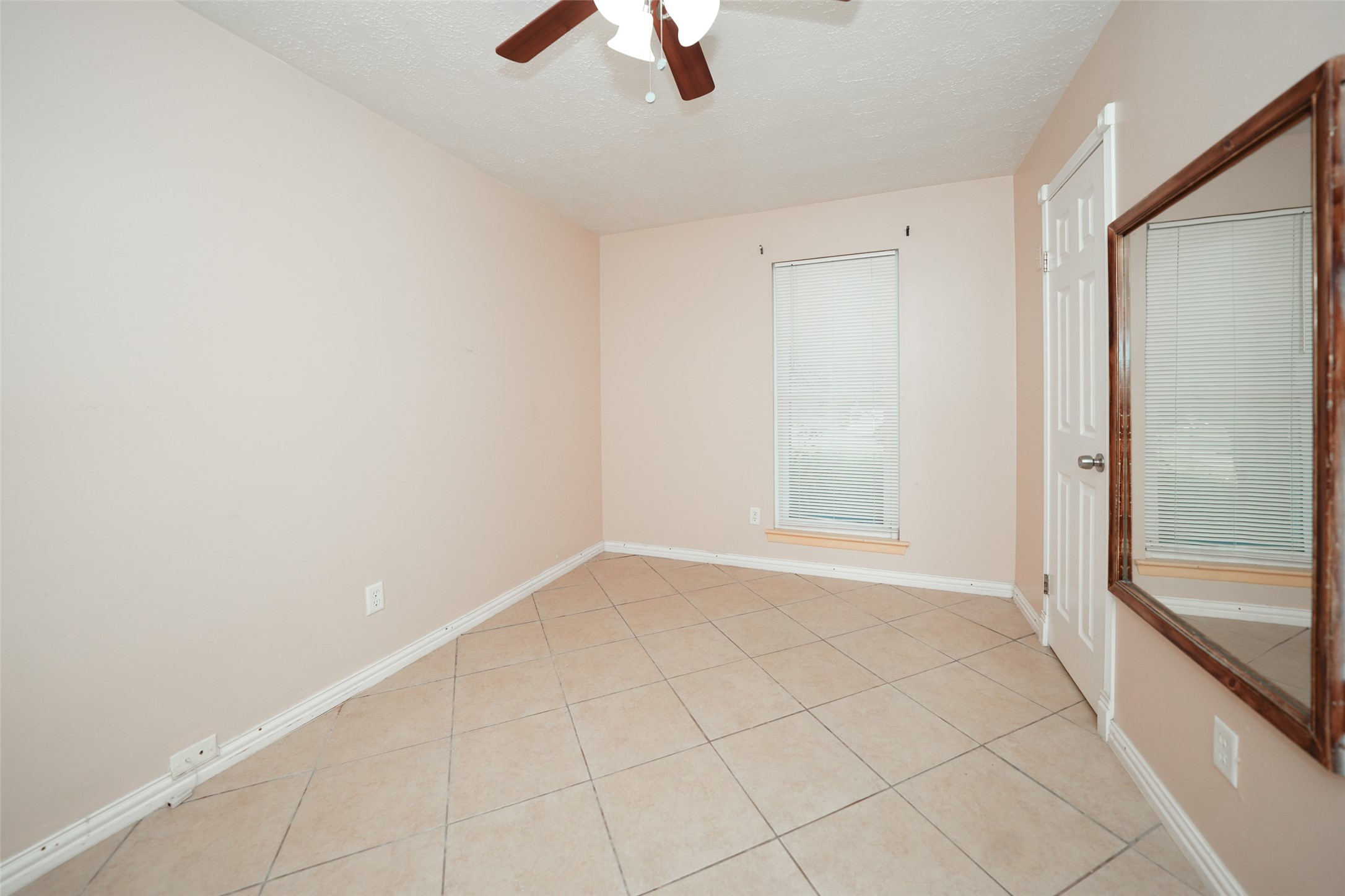 5227 Ridge Turn Drive Houston, TX 77053 - Photo 19 of 35 a view of an empty room and window