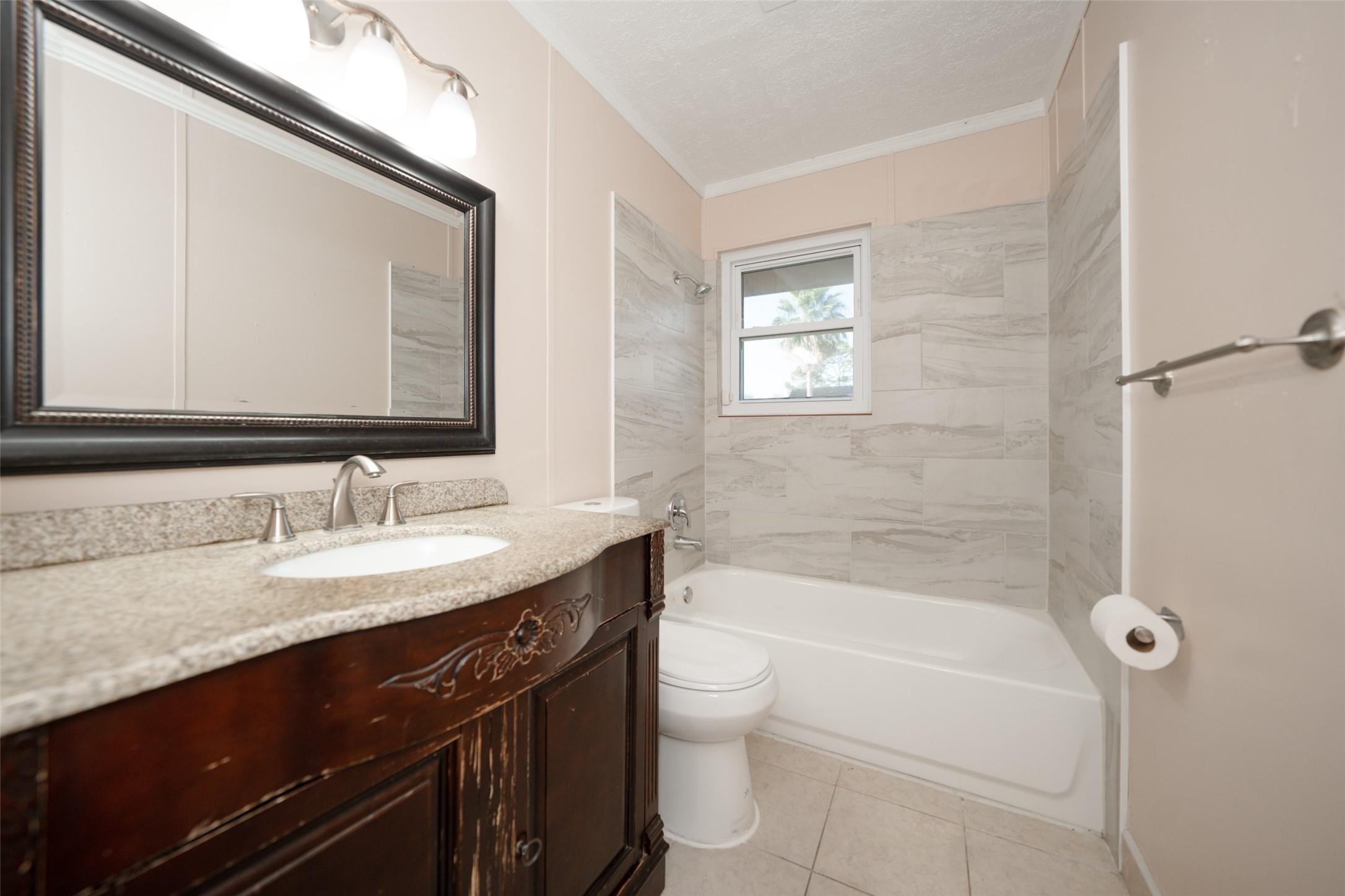 5227 Ridge Turn Drive Houston, TX 77053 - Photo 21 of 35 a bathroom with a granite countertop sink a toilet and shower
