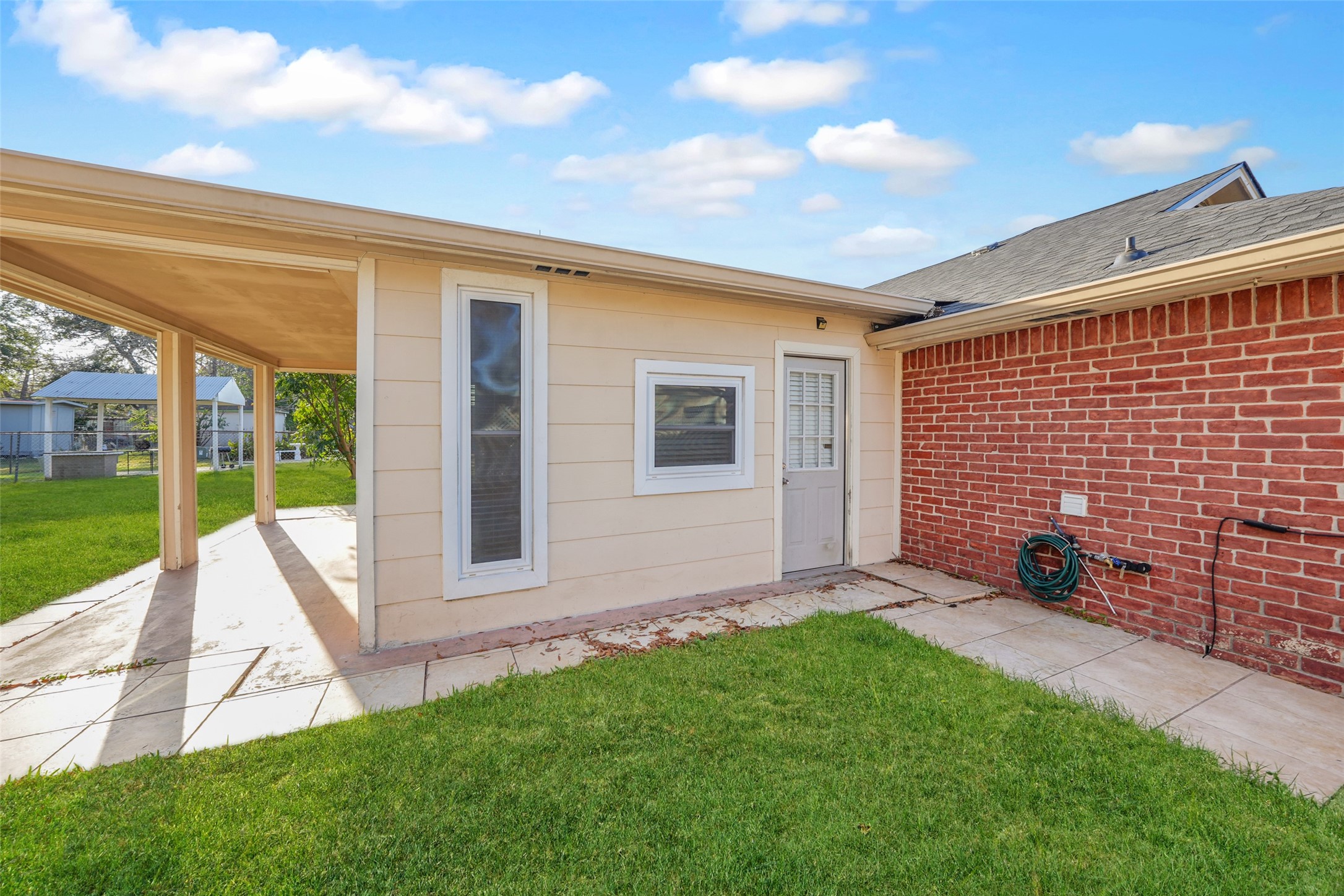 5227 Ridge Turn Drive Houston, TX 77053 - Photo 30 of 35 a view of backyard with table and chairs and wooden fence