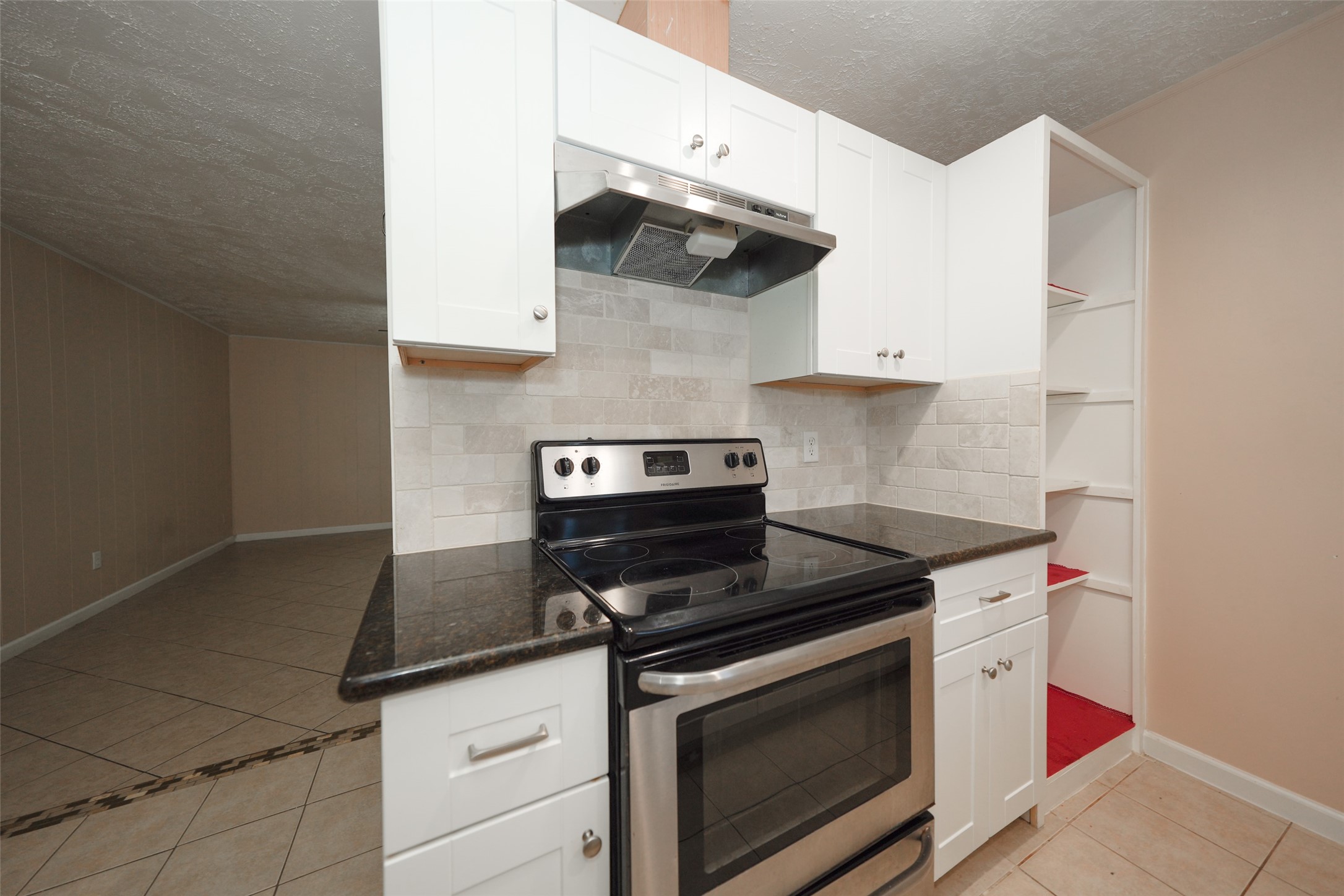 5227 Ridge Turn Drive Houston, TX 77053 - Photo 7 of 35 a kitchen with a stove and a microwave