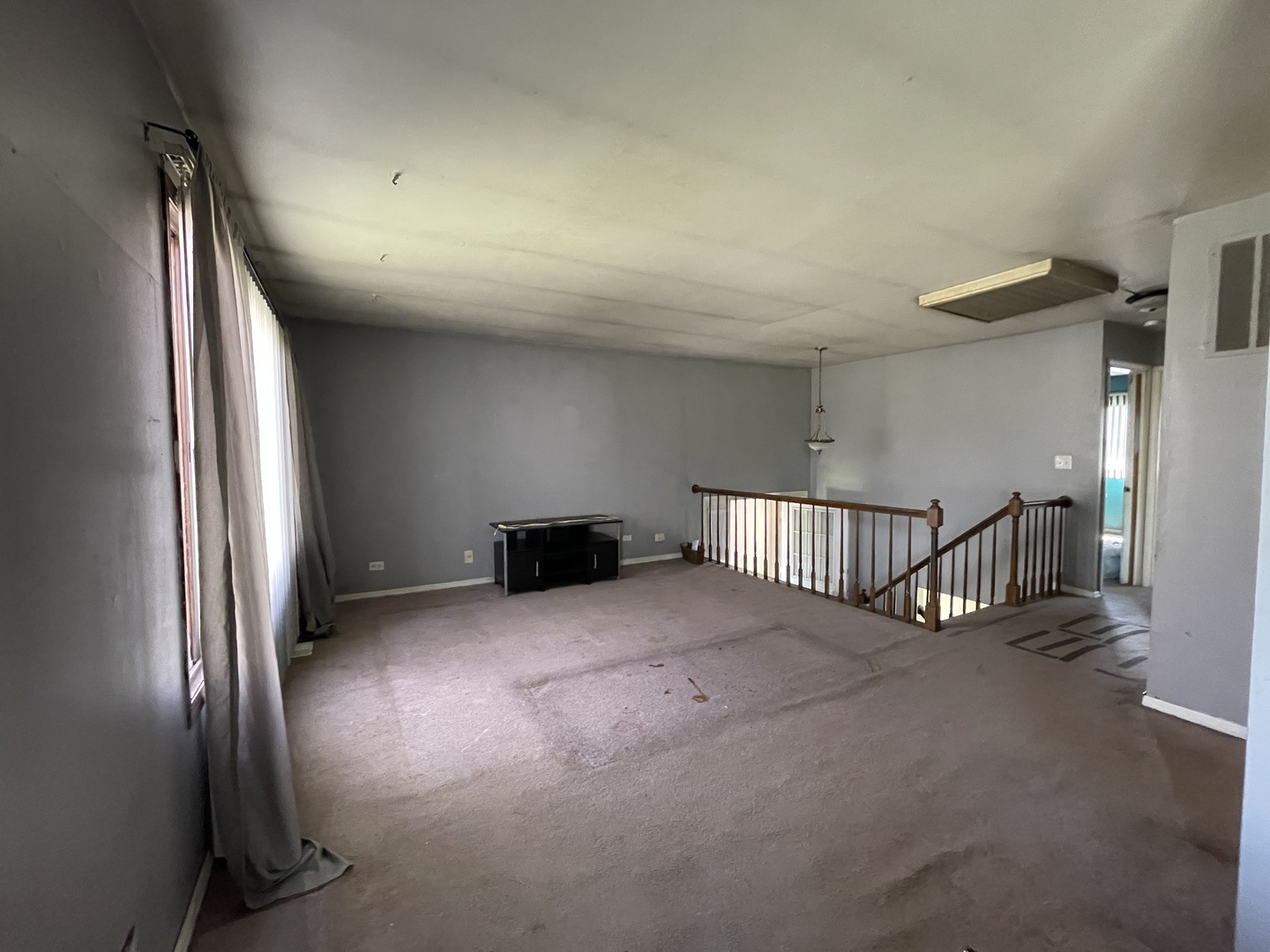 2061 Windward Lane Hanover Park, IL 60133 - Photo 3 of 15 a view of an empty room and stairs