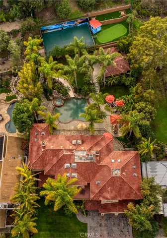 a view of an house with swimming pool and porch