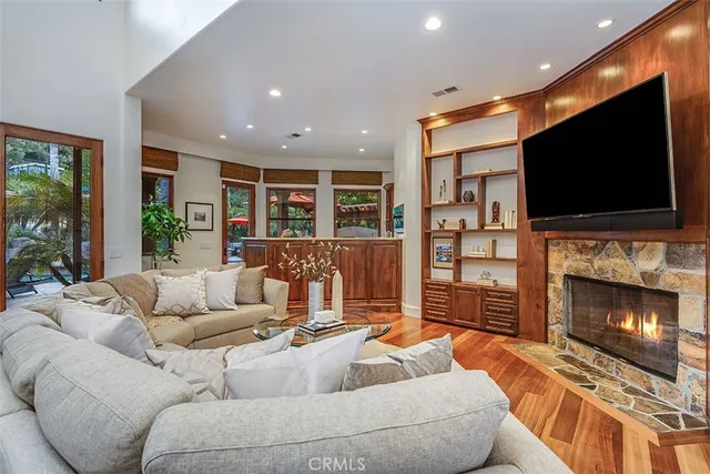 a view of a patio with a table and chairs under an umbrella