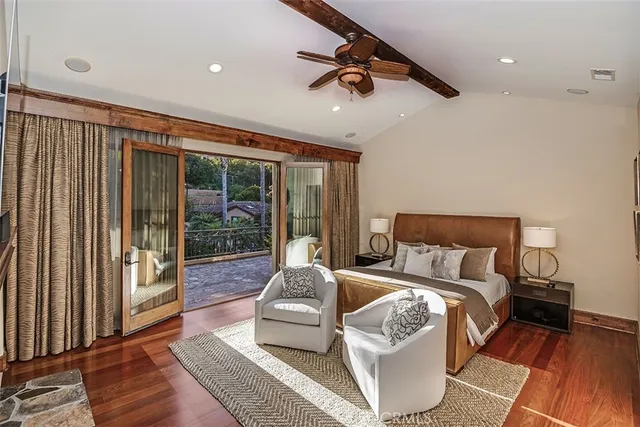 a bathroom with a glass shower door and mirror