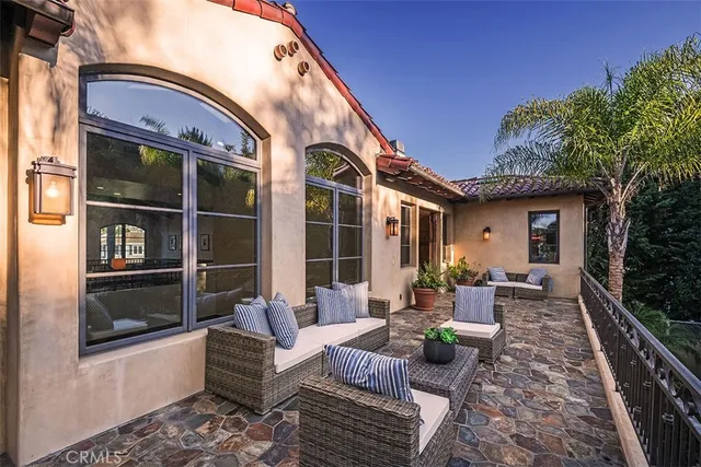 a view of a chairs and table in the patio