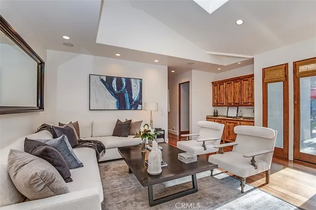 a view of patio with a table and chairs and potted plants