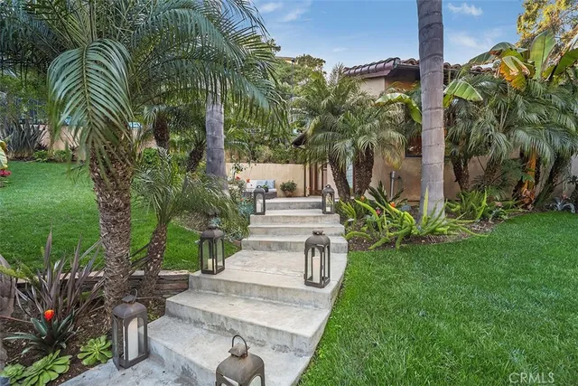 a bathroom with a granite countertop sink a mirror and a shower