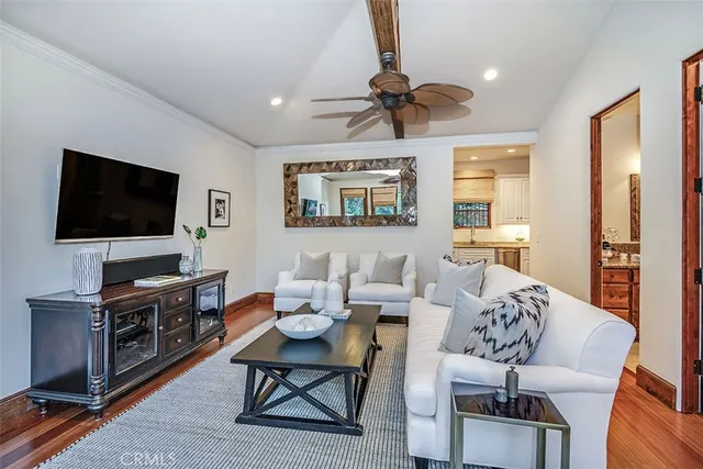 a patio with a table and chairs under an umbrella