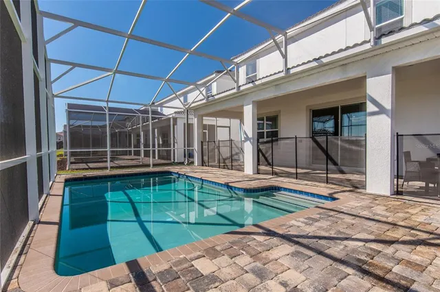 a view of swimming pool with seating area