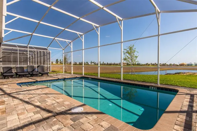 a view of a backyard with sitting area