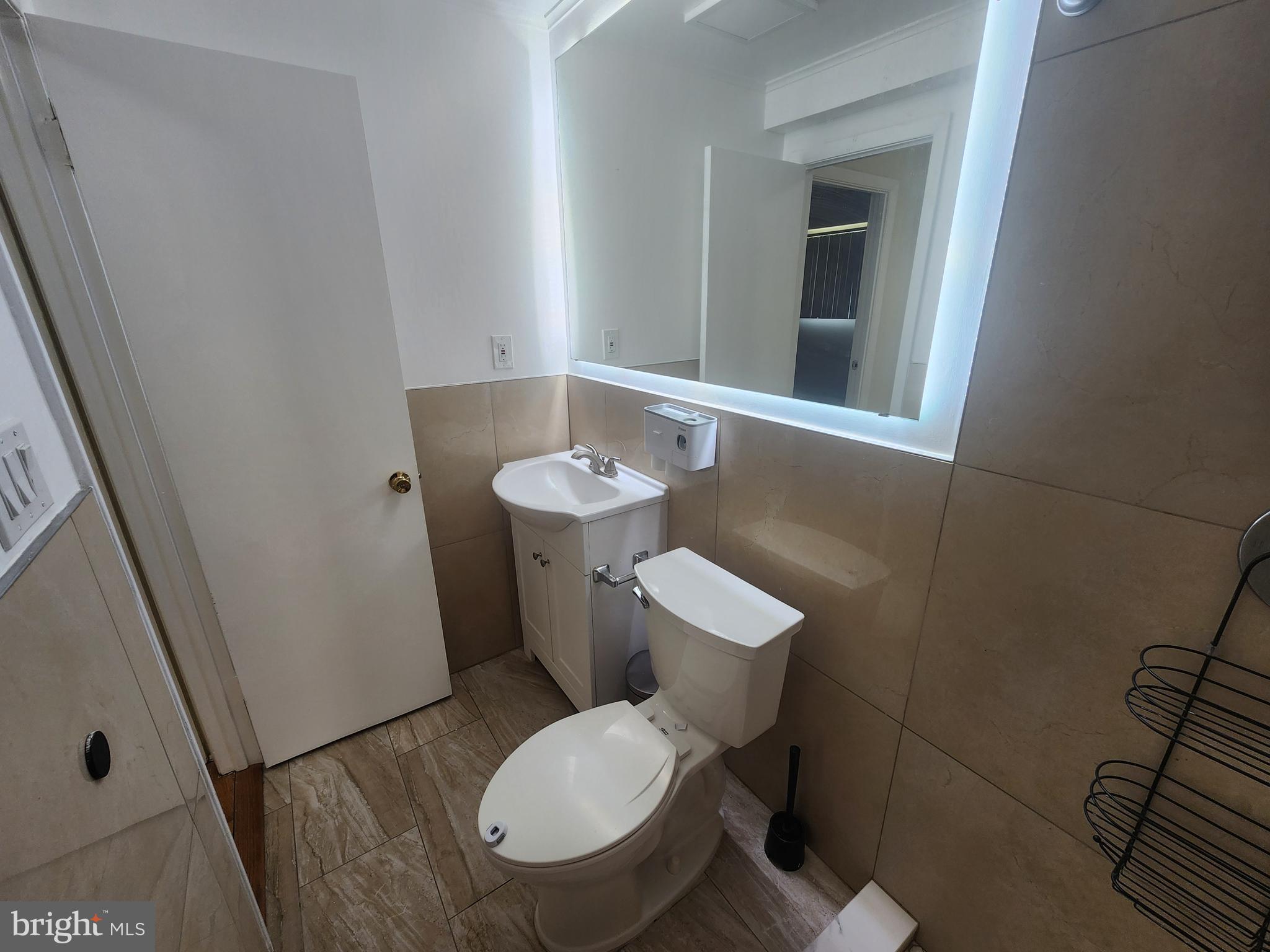 13416 Tamarack Road Silver Spring, MD 20904 - Photo 10 of 21 a white toilet sitting next to a bathroom sink