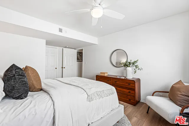 a bedroom with a bed and a couch