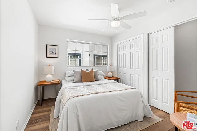 a bathroom with a granite countertop tub sink and mirror