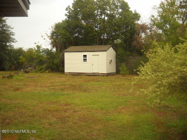 3355 Aldridge Road East Jacksonville, FL 32250 - Photo 10 of 12 Backyard W/Storage Building