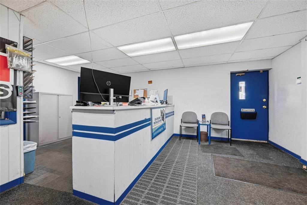 4225 Main Street Pittsburgh, PA 15224 - Photo 13 of 30 a kitchen with stainless steel appliances kitchen island granite countertop a sink and cabinets