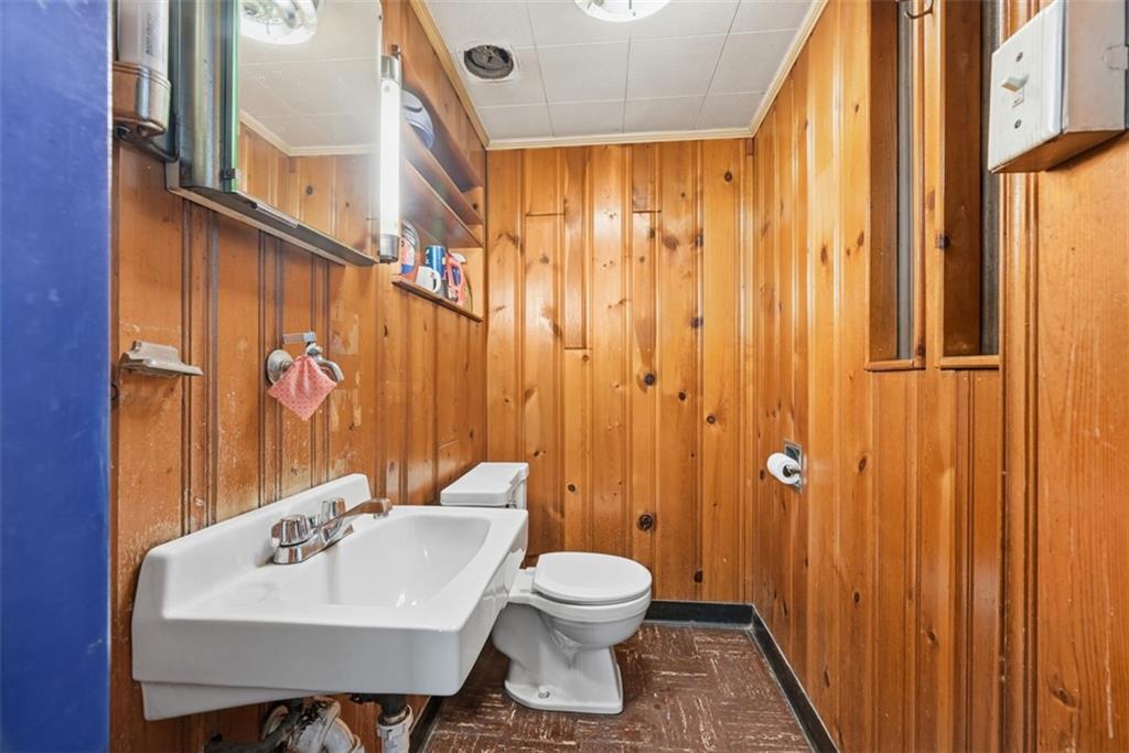 4225 Main Street Pittsburgh, PA 15224 - Photo 15 of 30 a bathroom with a sink a toilet and shower curtain